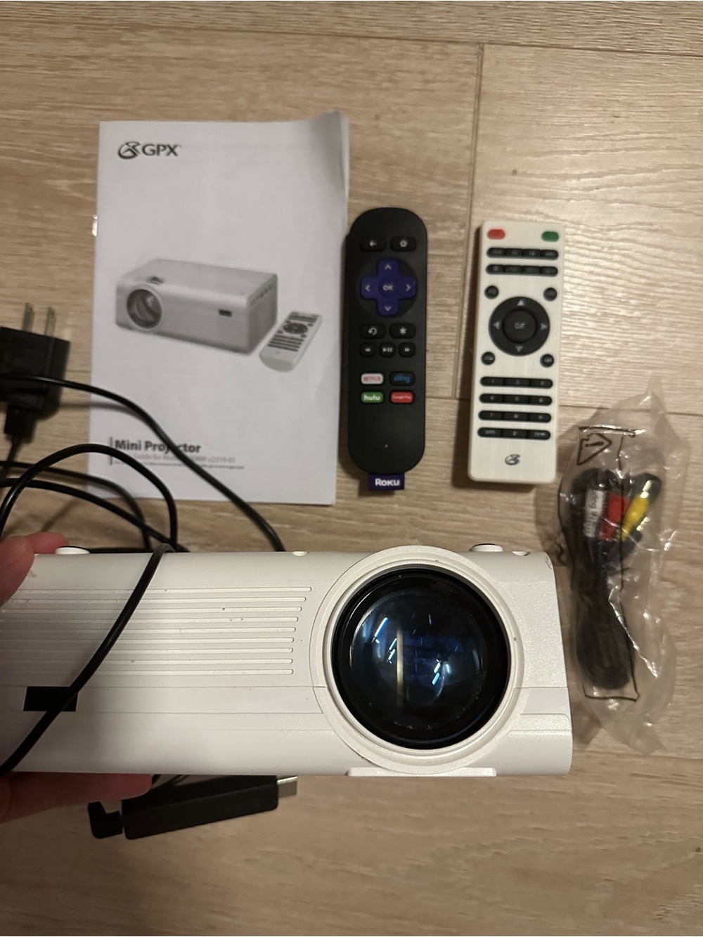 GPX White Mini Projector with ROKU Stick and Remote Control